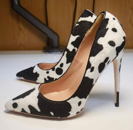 Cow print high heeled court shoes