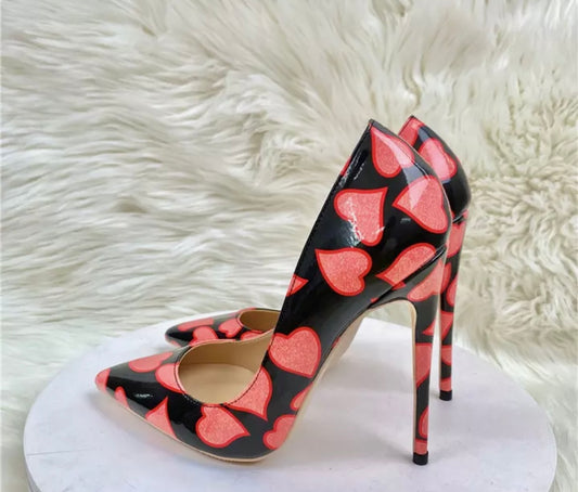 Black high heeled shoes with red hearts