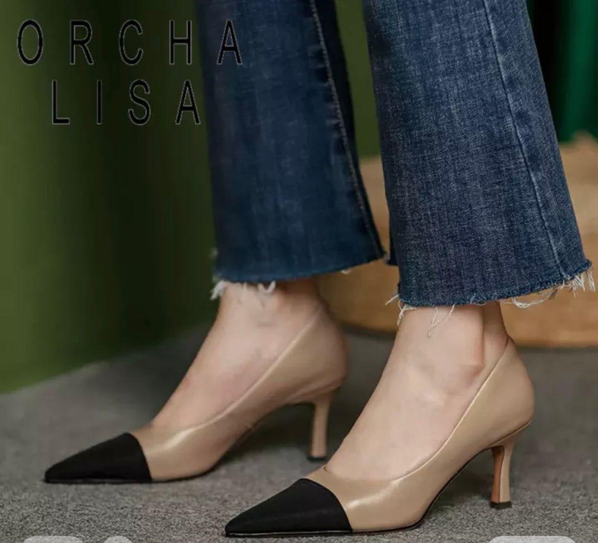 Beige and sales black pumps