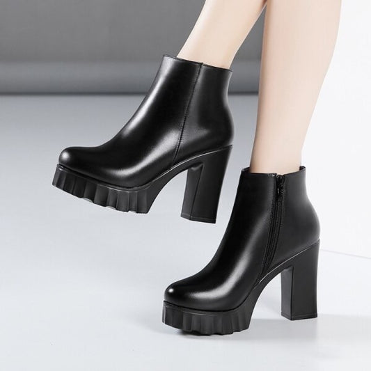 Black chunky ankle boots with thick track sole