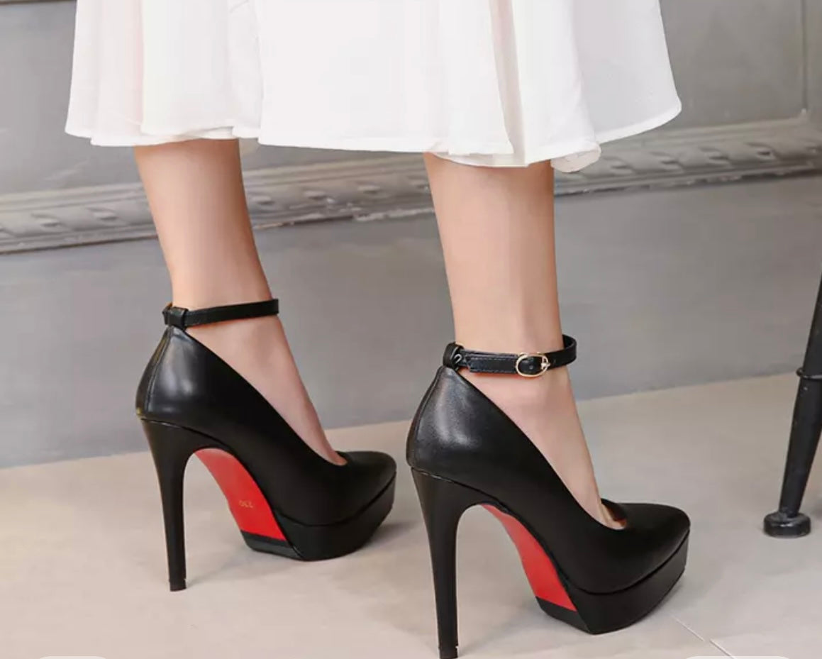 Black high heeled mary jane court shoes with red sole